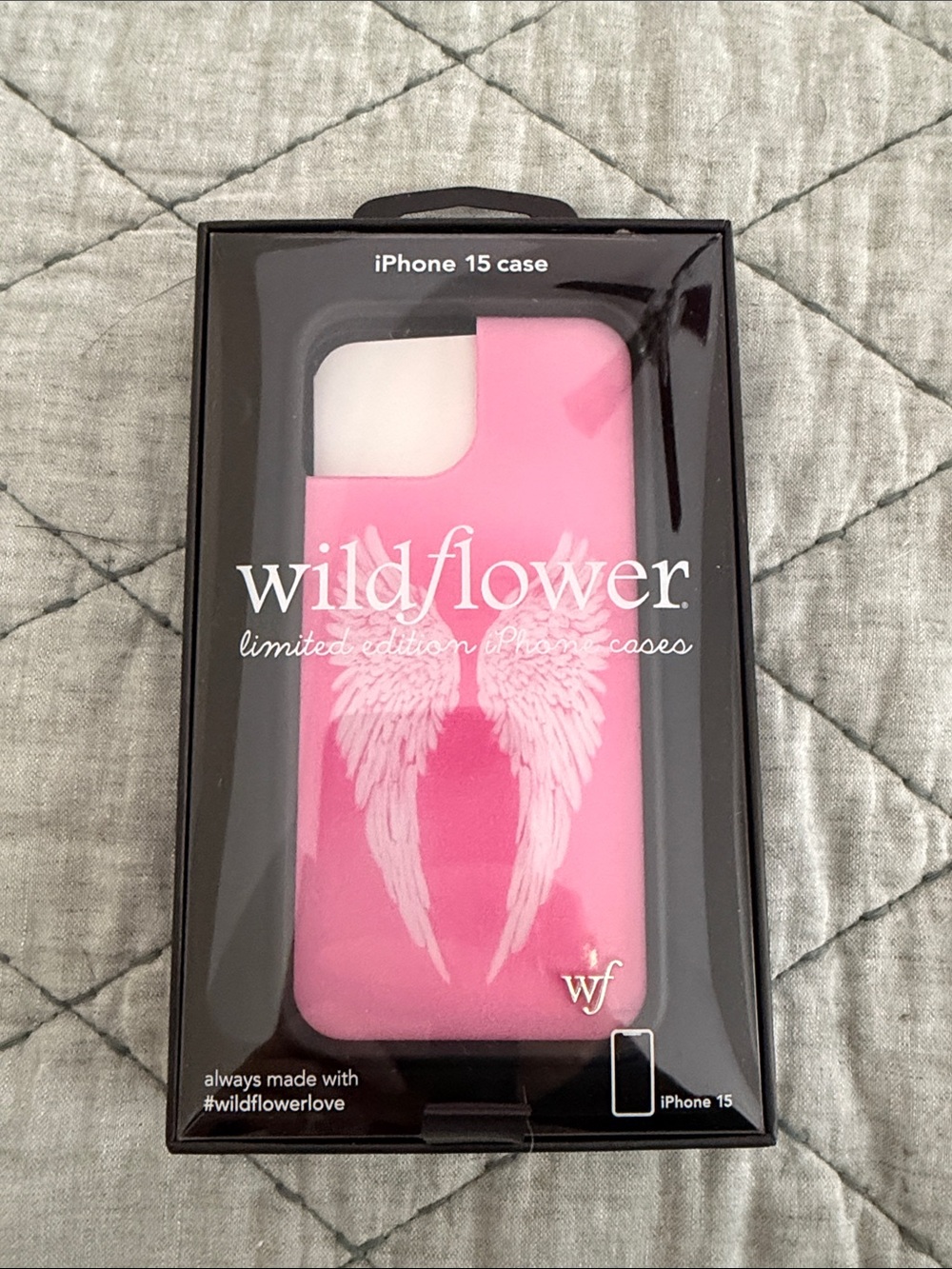 Wildflowers Pink iPhone 15 Case with White Wing Design